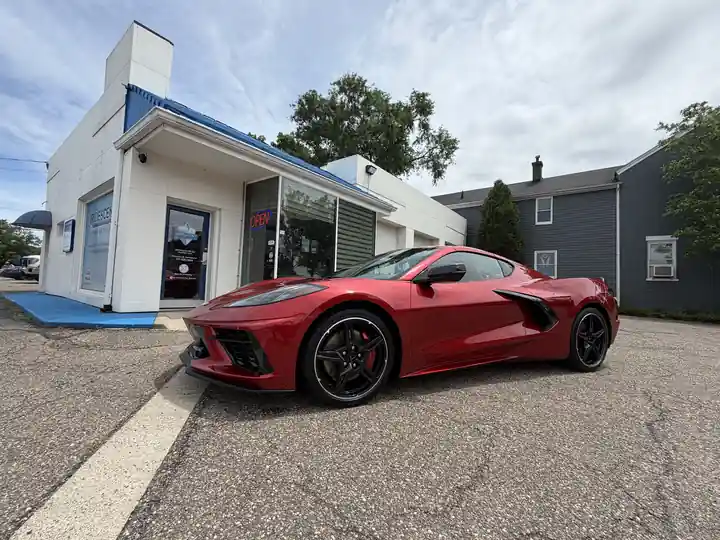 Red C8 Corvette on the lot at 2nd and Greene