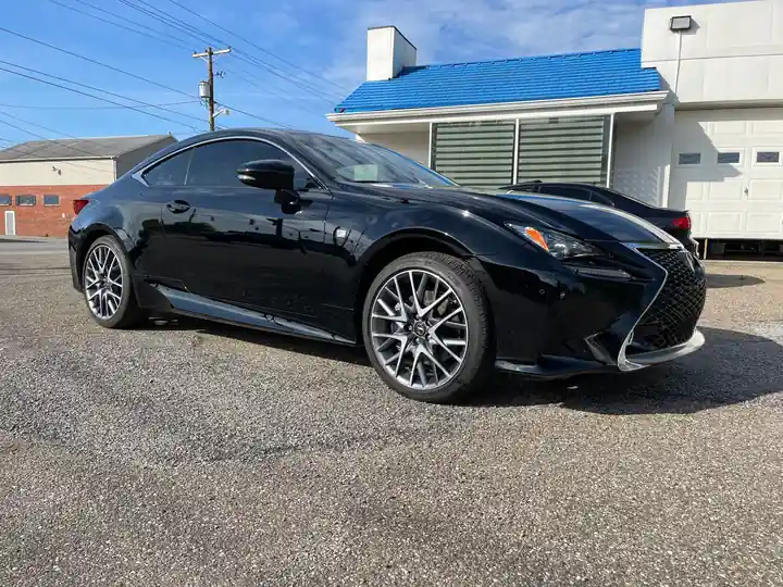 Black Lexus RC F Sport parked at the shop