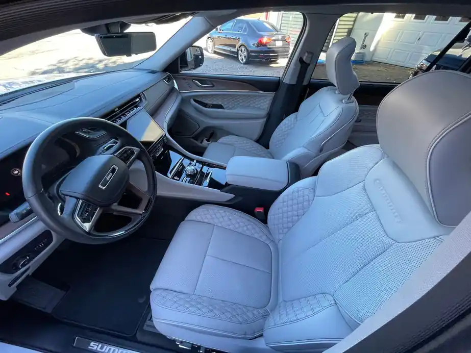 Quilted grey leather seats in a Grand Cherokee Summit after an interior detail